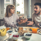 couple arguing over breakfast table